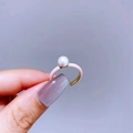Detail of light luxury pink enamel adjustable ring with white pearl and gold plating - Gold Light Pink Pearl Style