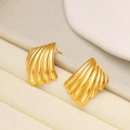 Macro view of gold seashell stud earrings with textured radial stripes on jewelry display - Fan Shell Style (CK106)