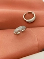 Sparkling silver adjustable ring with full pavé cubic zirconia on pink fabric background - Open Ring / White Gold