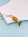 Macro shot of koi fish pendant with orange scales and green enamel on a golden chain - Red Green And Orange Style