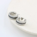 Detail of silver twist earrings with black zircon inlay on white ceramic plate - Silver Tone Black Rhinestone (CK359)