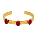 Detail view of gold titanium steel open bangle with three oval red zircon stones - Gold (Red Zirconia)