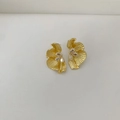 Detail view of golden wing earrings with textured surface and sparkling drop zircons - Petal Style (Earring 02) / Gold
