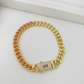 Bracciale a catena cubana oro e arancione con chiusura gioiello e lettera S incisa - Braccialetto (Braccialetto 11) / Oro e Arancione