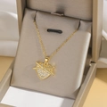 Gold heart pendant necklace with clear zircon stones on a luxury silk gift box background - Crossover Wrap Heart Style (X317) / Gold