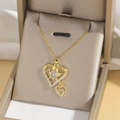 Luxurious gold heart pendant necklace with shimmering crystals on a champagne jewelry box - Double Layered Heart Style (X4014) / Gold