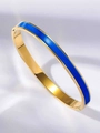 Detail of gold-plated bangle with blue enamel finish and secure hinge clasp design - Dark Blue