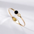 Detailed view of gold hinged bangle featuring black and white shell rings with Roman numerals - Roman Numeral Shell Patchwork Style (TT0865)