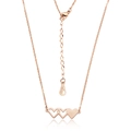 Detail of rose gold triple heart pendant showing the 18KGP mark on the adjustable chain - Rose Gold (N462)