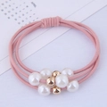Detail of pink three-strand elastic hair ties with white pearls and gold bead accents - Pink (090520266)