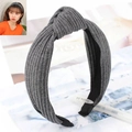 Minimalist grey ribbed knit twisted headband for women with a non-slip black lining - Gray