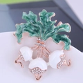 Fashionable radish plant brooch with white bulbs, green enamel leaves, and clear crystals - White