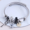 Silver cable cuff bracelet featuring elk charm and crystal beads on marble display - Black Bear Pendant Style (3#)