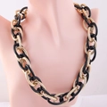Modern chunky chain necklace featuring mixed black and gold textured oval links - Black and Gold