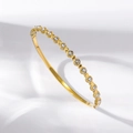 Detailed macro view of gold-tone titanium steel bracelet with sparkling white zircons - Prong Set Round Stones Style (TT0985) / Gold