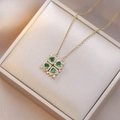 Golden clover necklace with green heart-shaped gems and diamonds on silk lining - Green Heart Clover (X0700) / Green
