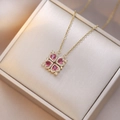 Golden clover necklace with four red heart gemstones and sparkling crystal accents - Magenta Heart Clover (X0906) / Rose Red