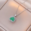 Silver-toned heart necklace featuring a green gemstone pendant surrounded by zircon stones - Silver - Emerald Green Rotating Heart (X1183)