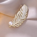 Detailed view of elegant gold feather brooch with white pearl and inlaid zircon stones - Full Diamond Feather Style (6)