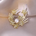 Close-up of golden floral brooch with yellow zircon petals and white freshwater pearl detail - Yellow Zircon Flower Cluster Style (1)