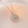 Silver evil eye heart necklace with green stone and pavé zircon on satin background - Cross Chain Evil Eye / Silver (Steel Color)