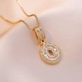 Elegant gold double oval pendant necklace with zircon crystals on premium silk background - Letter O Style (X2636)