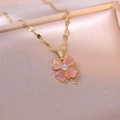 Pink heart clover necklace with gold chain and crystals on elegant champagne satin fabric - Pink