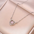 Elegant silver necklace with a layered heart pendant featuring a pink central stone - Pink Heart Pendant Necklace