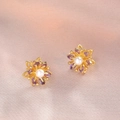 Elegant gold flower stud earrings with purple marquise gems and white pearl center - Purple Gold Daisy Earrings