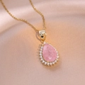 Pink teardrop pendant necklace with gold chain and crystals on champagne silk background - Pink Ice Flower (Crackle Style)