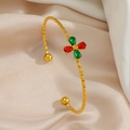Close-up of gold open bangle with diamond textured pattern and colorful gemstone inlay - Red Green Gemstone Flower Style (TT0758)