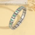 Macro view of stainless steel stretch bracelet links with green enamel cross charms - Green Cross Style (TT0916--7)