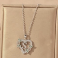 Detailed view of silver heart pendant with letter S and green zirconia stones - Hollow Heart Letter S Necklace / Silver