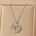 Detail of silver heart necklace with letter C, green stones and floral pattern - Hollow Heart Letter C Necklace / Silver