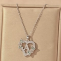 Detail shot of heart-shaped letter A necklace with green floral accents in gift box - Hollow Heart Letter A Necklace / Silver