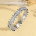 Detailed view of silver titanium steel bangle with sharp spikes and baguette-cut zircons - Sharp Spike Row Diamond Punk Style (TT0913)