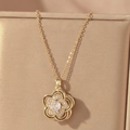 Detail of gold flower pendant with central white zircon and pavé stones on a stand - Gold Multi-layer Three-dimensional Floral Style (X0654)