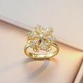 Eleganter goldener Schneeflockenring mit Zirkonia-Kristallen und poliertem Band für Damen - Goldener Schneeflocken-Ring