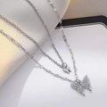 Double layered bow necklace in silver finish with pavé zircon butterfly pendants - Butterfly Double Layer Necklace (X0221)