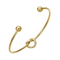 Elegante bracciale rigido a nodo dorato con terminali a sfera in un design minimalista - Oro