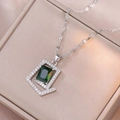 Silver necklace featuring a rectangular emerald green gemstone pendant with zircon frame - Emerald Necklace (X3574)