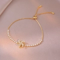 Bracciale dorato regolabile con ciondolo a girasole rotante e zirconi brillanti - Bauhinia Rotante (TS0322) / Oro