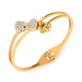Bracciale rigido doppio in acciaio titanio dorato con ciondoli a cuore e quadrifoglio - Oro
