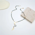 Detailed view of religious rosary necklace with blue beads and golden cross pendant - Blue (Style 5)