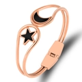 Detail view of a rose gold moon and star bracelet with black enamel inlays and spring clasp - Rose Gold With Black Enamel