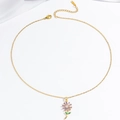 Golden sunflower necklace with purple zircon petals and green leaves on white background - Gold Purple Style (X3803)