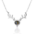 Silver reindeer antler projection necklace with crystals on a white reflective base - Silver