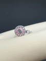 Macro shot of silver ring with pink zircon floral design and radiant gemstone setting - Rotating Circular Pink Zirconia Style (JZ80) / Silver