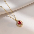 Macro view of vintage titanium steel necklace with a red oval gemstone and gold sequins - Red Gemstone Necklace Set (With Pendant)