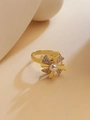 Detail of rotating windmill ring with gold finish, sparkling zircons, and a center pearl - Rotating Windmill Style (JZ96)